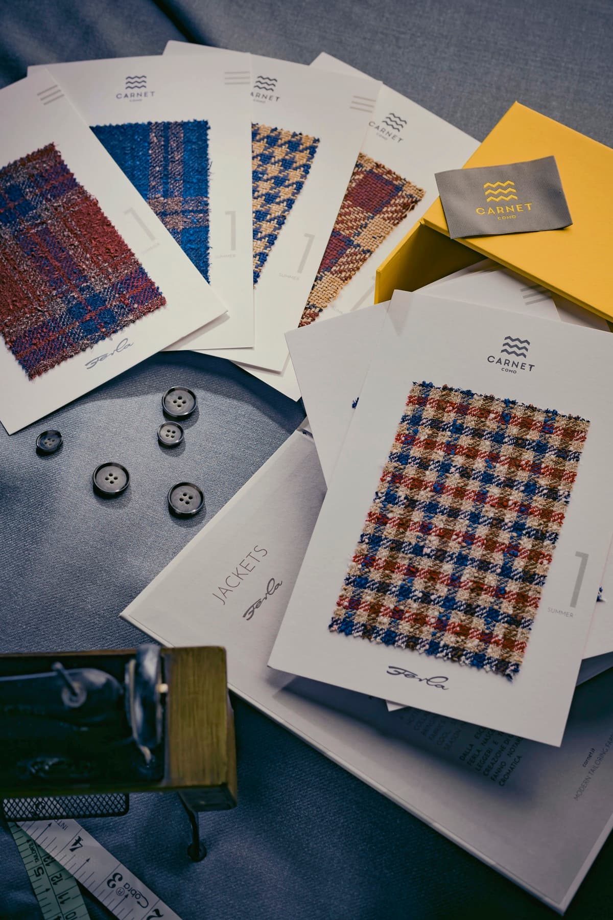 Carnet jacketing swatches fanned with horn buttons