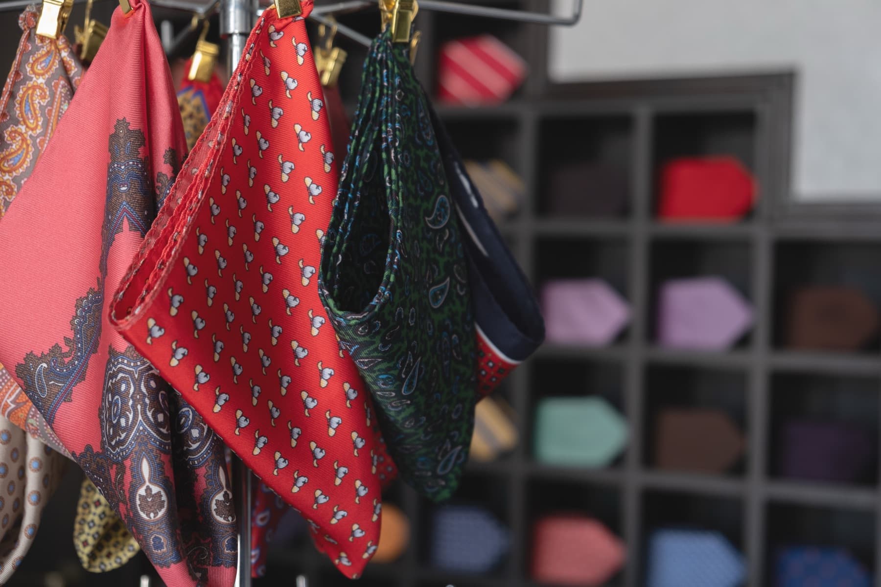 Silk pocket squares on the showroom rack