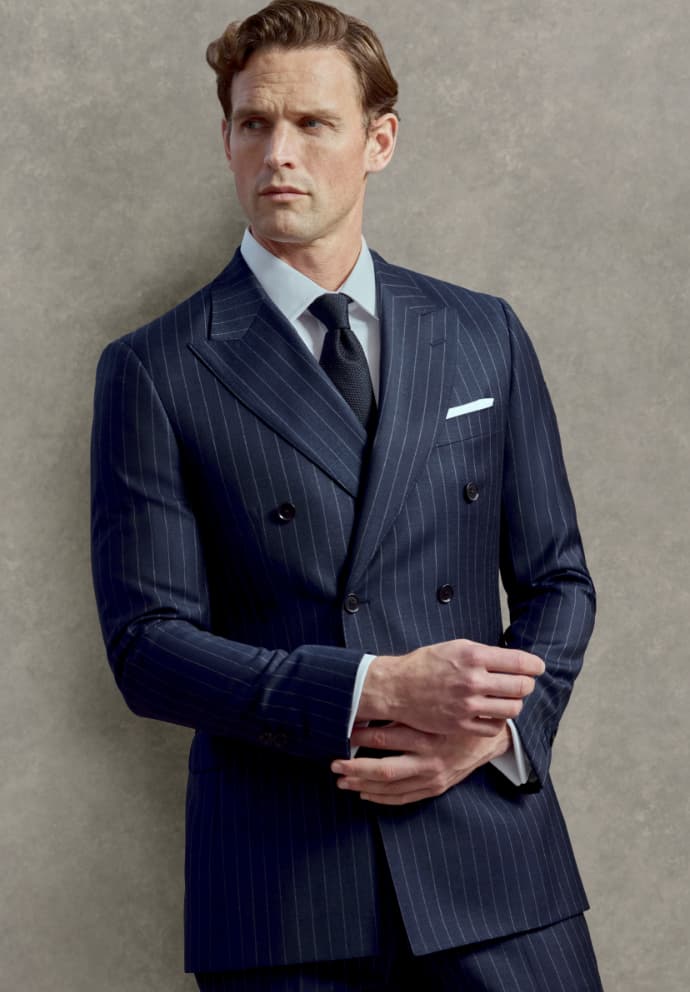 A bespoke navy windowpane suit, hand-finished